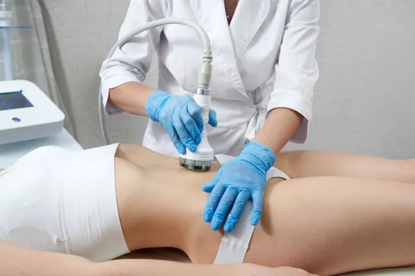 Lost the Weight but Not the Loose Skin? 2 woman having HIFU treatment on her stomach to combat loose skin Dunchurch following weight loss
